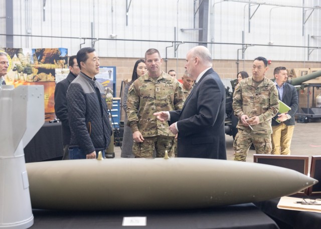 PICATINNY ARSENAL, N.J. - Mr. Young Bang, Principal Deputy Assistant Secretary of the Army Acquisition, Logistics and Technology (AL&T), receives a brief from the newly established Project Director, Joint Ammunition and Weapon Systems Office which...