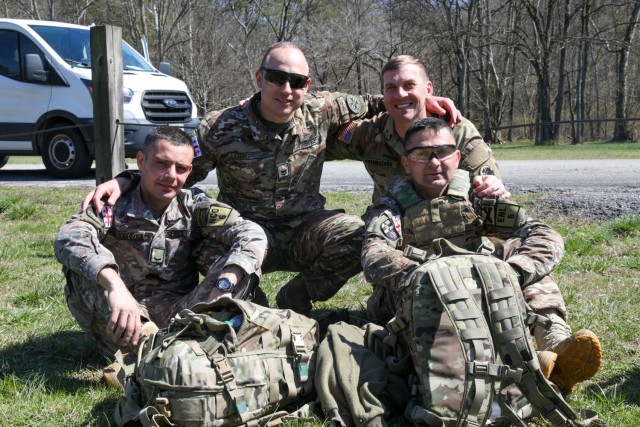 Georgia Defense Force Junior Sergeant Paata Sabiashvili, front left, an infantryman representing the 1st Infantry Brigade; Georgia Defense Force Corporal-Specialist Irakli Nozadze, front right, a cannon crewmember representing the 5th Artillery Brigade; 1st Sgt. Sergo Kandelaki, back left, executive assistant to the Georgia Defense Force Command Sergeant Major, Georgia Defense Force General Staff; and Staff Sgt. Michael Tenoshcok, back right, Joint Operation Center noncommissioned officer, Joint Force Headquarters, Georgia National Guard; pose for a photo during the 2024 Georgia Army National Guard State Best Warrior Competition at the Catoosa Volunteer Training Site, Ringgold, Georgia, March 12, 2024.  (U.S. Army National Guard photo by Pfc. Princess Alexandria Higgins)
