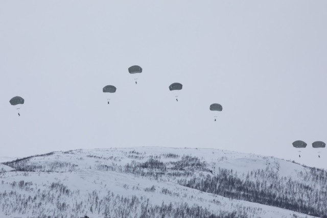 U.S. Army Soldiers with 1st Battalion, 501st Parachute Infantry Regiment, 2nd Infantry Brigade Combat Team (Airborne), 11th Airborne Division, descend onto Lake Takvatnet during Arctic Shock 24 near Bardufoss, Norway, March 18, 2024. The jump follows an over-the-pole flight from Alaska, showcasing the 11th Airborne Division&#39;s capability to insert anywhere into the Arctic.