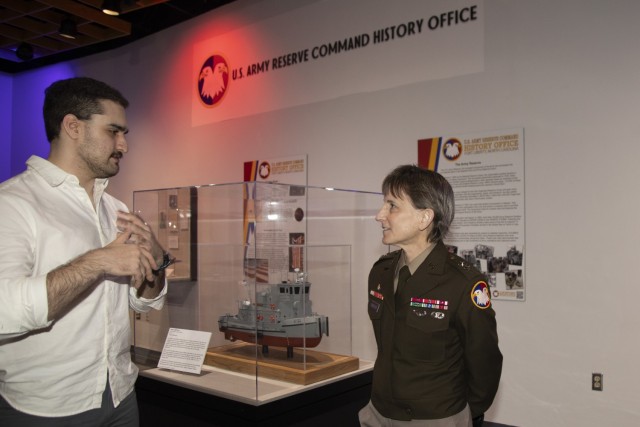 Maj. Gen. Stacy Babcock, Chief of Staff of the U.S. Army Reserve Command and Connor Friend discuss artifacts from the U.S. Army Reserve Command History Office as part of the temporary exhibit “Opening the Vaults: Treasures of the Fort Liberty Museums" on March 13, 2024 at the Airborne and Special Operations Museum in Fayetteville, North Carolina. The collection includes items rare and never-before-seen artifacts from the U.S. Army Reserve, Airborne and Special Operations Museum, John F. Kennedy Special Warfare Museum, 82nd Airborne Division War Memorial Museum, and 503D Military Police Battalion (Airborne). (U.S. Army Photo by Sgt. Natalie Pantalos)