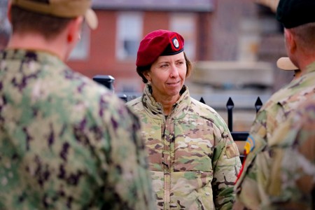 Command Sgt. Maj. JoAnn Naumann says she never sought a job or promotion to be a trailblazer and doesn’t really think of herself as one. Here she speaks with sailors on the dock of the historic USS Constitution on Dec. 4, 2023. 