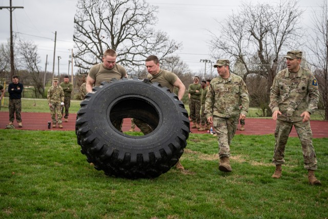Advanced Individual Training Soldiers with Company D, 554th Engineer Battalion, participate in the tire-flipping competition during a celebration of St. Patrick, the patron saint of engineers, hosted by the Fort Leonard Wood Marine Corps...