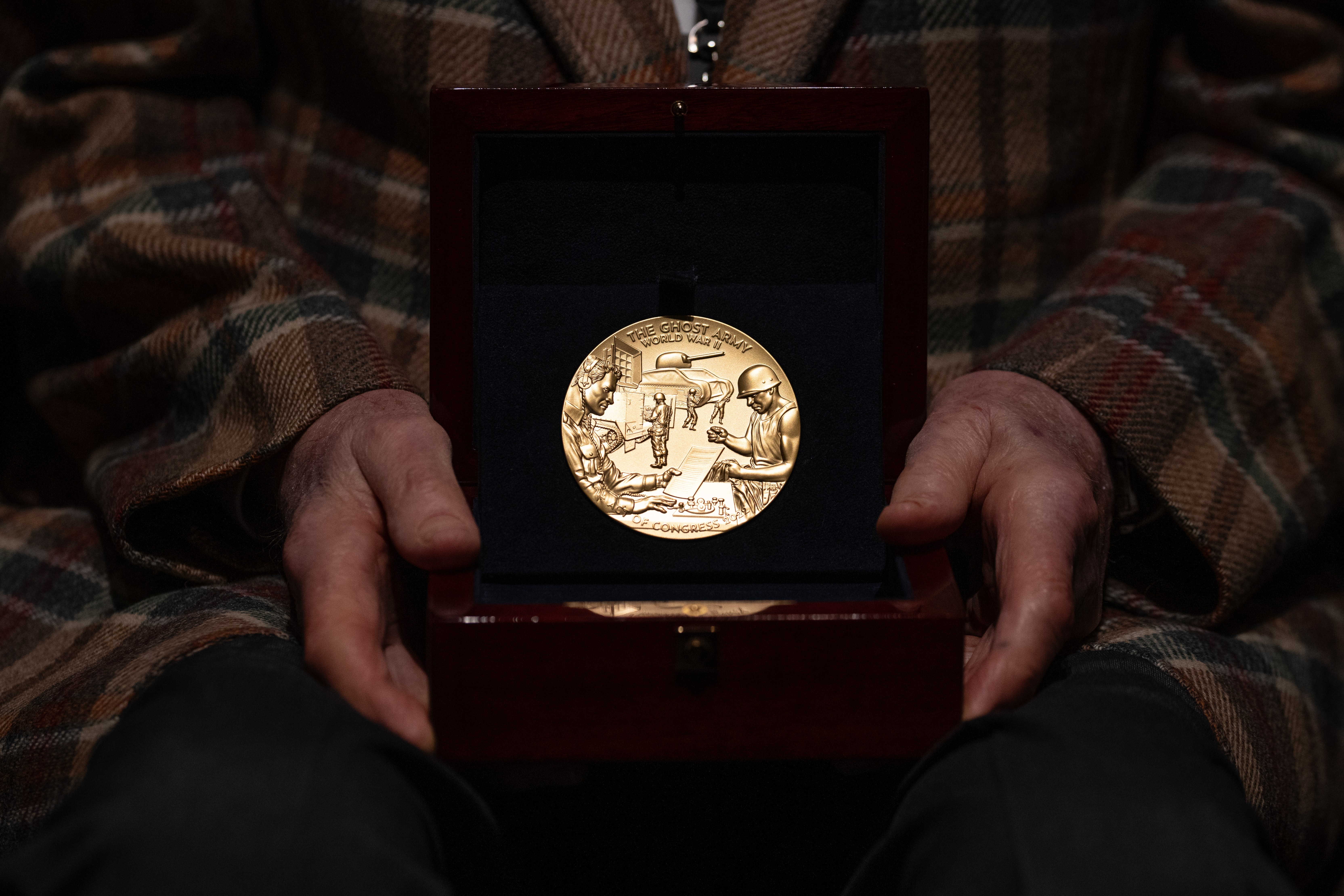 World War II Ghost Army veteran Bernard (Bernie) Bluestein, a 100-year-old resident of Hoffman Estates, Ill. and former U.S. Army Pfc., holds the Congressional Gold Medal prior to a ceremony honoring World War II Ghost Army veterans in...