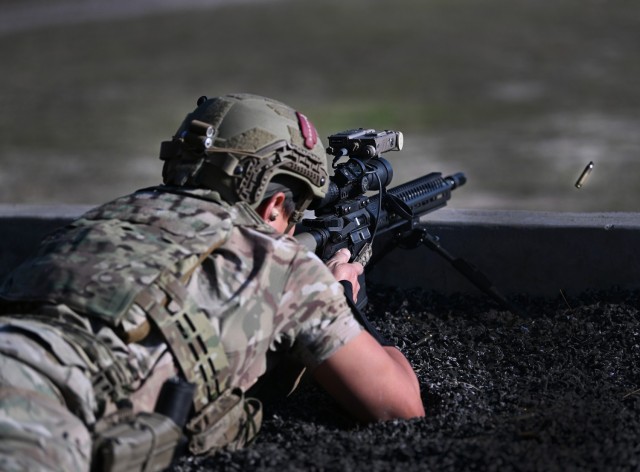 A competitor USASOC International Best Sniper Competition engages various targets on a range at Fort Liberty, North Carolina, March 19, 2024