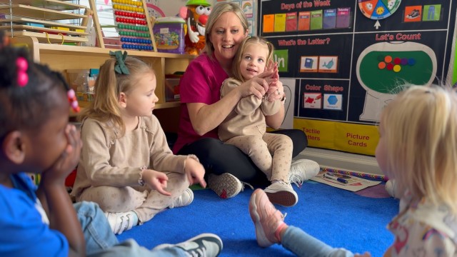 Amanda Crofutt, a Family Child Care provider at Fort Campbell, sings with children during circle time, Feb. 8, 2024. The FCC program offers an alternate option to the Child Development Center or Youth Center on post, providing in-home care for infants through school-aged children. 