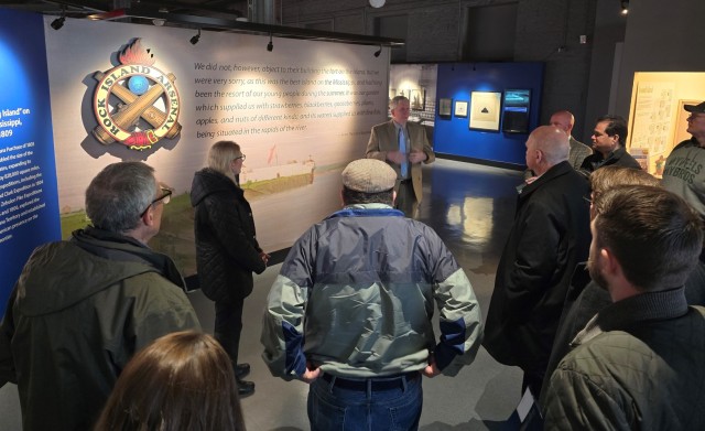 Robert Foster, a Rock Island Museum volunteer and member of the museum’s historical society, introduces the visiting dignitaries to the recently renovated facility.
