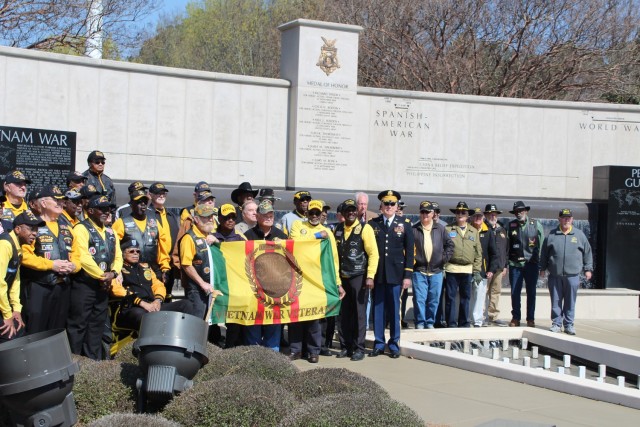 Vietnam veterans gather for a group photo after Saturday’s 12th annual Vietnam War Veterans Day celebration in Huntsville/Madison County Veterans Memorial Park.