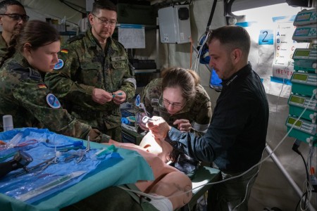 U.S. Army Reserve Soldiers with Medical Support Unit - Europe, the German Forces Joint Medical Service and 30th Medical Brigade practice airway intubation on an unconscious patient using a medical simulation unit during Exercise Allied Spirit in Hohenfels, Germany, Mar. 14, 2024. This multinational training exercise gathered medical units from the U.S. Army Reserve, the 30th Medical Brigade, and German partners to provide NATO Role 2B field operational capabilities including evacuation, triage and resuscitation, treatment and holding of patients until they can be returned to duty or evacuated, emergency dental treatment, emergency surgery and essential post-operative management.