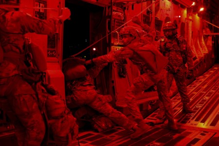 Army paratroopers participate in a nighttime airborne operation near Fort Johnson, La., March 10, 2024. The training strengthens readiness and ability to deploy around the world within 18 hours.