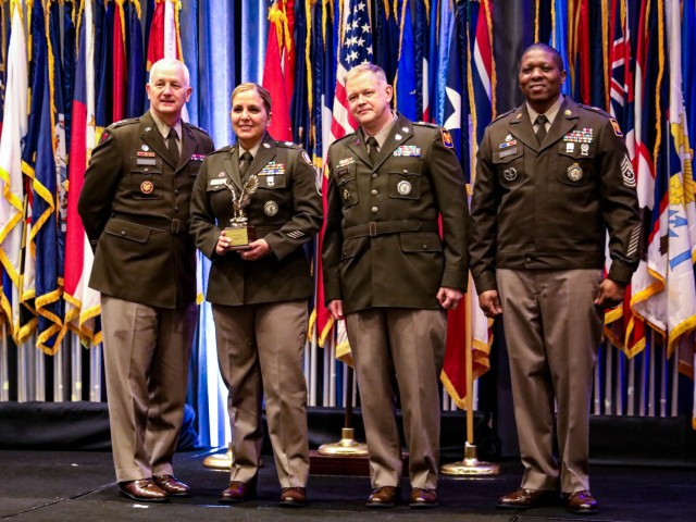 U.S. Army Staff Sgt. Andrea Rayburn, second from left, from the Louisiana Army National Guard, receives the Top Production Recruiter award from Lt. Gen. Jon Jensen, far left, Director of the Army National Guard, at the Director’s Strength Maintenance Awards Conference in Houston, Texas, Mar. 14, 2024. The Director’s Strength Maintenance Awards Conference offered recruiting and retention Soldiers the opportunity to network, exchange best practices, and honor the Army National Guard’s best recruiters.