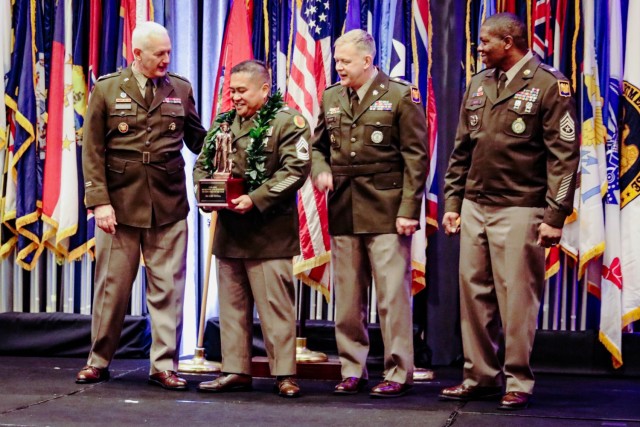 U.S. Army Master Sgt. Earl Ventura, second from left, from the Hawaii Army National Guard, receives the Best Recruiting and Retention Non-Commissioned Officer in Charge award from Lt. Gen. Jon Jensen, far left, Director of the Army National Guard at the Director’s Strength Maintenance Awards Conference in Houston, Texas, Mar. 14, 2024. The Director’s Strength Maintenance Awards Conference offered recruiting and retention Soldiers the opportunity to network, exchange best practices, and honor the Army National Guard’s best recruiters.