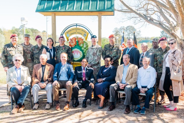 German partners, military leaders and civil leaders stand at the U.S. German Friendship crest at Johnny Henderson Park in Enterprise, Ala. during the ceremony on March 28. 