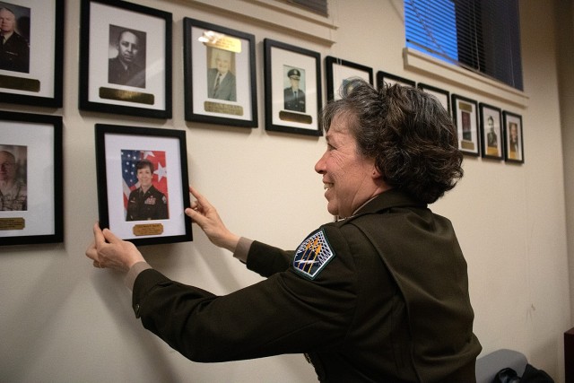 Lt. Gen. Maria Barrett, commander of Army Cyber Command (ARCYBER), places her photo in the Reserve Officers&#39; Training Corps (ROTC) hall of fame at the Massachusetts Institute of Technology during a ceremony in her honor at her former ROTC battalion -- the Paul Revere Battalion -- March 27, 2024. Barrett spoke with cadets and was inducted into the battalion hall of fame during her visit. (Photo by Cadet Giada James)