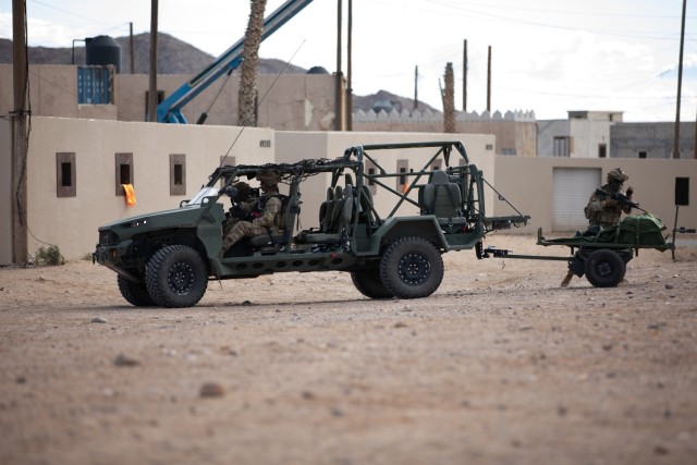 U.S. Army soldiers with the Maneuver Center of Excellence Experimental Company, 1st Battalion, 29 Infantry Regiment, 316th Cavalry Brigade, conduct an urban assault during a series of Human Machine Integration experiments in a training environment as part of Project Convergence – Capstone 4 at Fort Irwin, Calif., March 18, 2024. 
