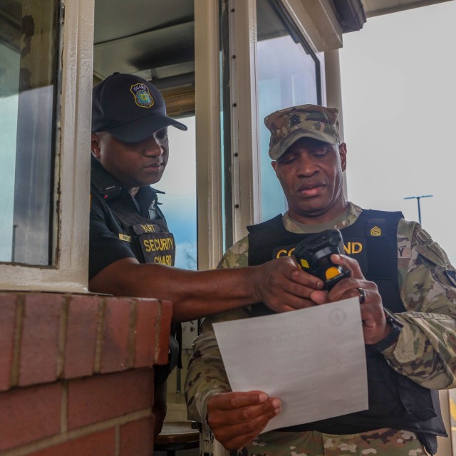 Command Sgt. Maj. Sherm Waters scans a visitor’s pass at Chaffe Gate while joining Col. Chris Ricci, Garrison commander, to work as a gate guard at Fort Knox, Kentucky, April 1, 2024. Ricci and Waters try to regularly get involved with a variety...