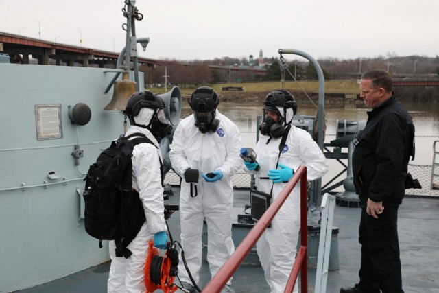 Soldiers and Airmen assigned to the 2nd Weapons of Mass Destruction Civil Support Team complete a communication check before executing an exercise aboard the USS Slater museum ship in Albany, New York, March 28, 2024. The CST Soldiers and Airmen worked with the New York State Police and the Federal Bureau of Investigation to identify radiological sources aboard the ship during the joint training exercise. (U.S. Army National Guard by Stephanie Butler)