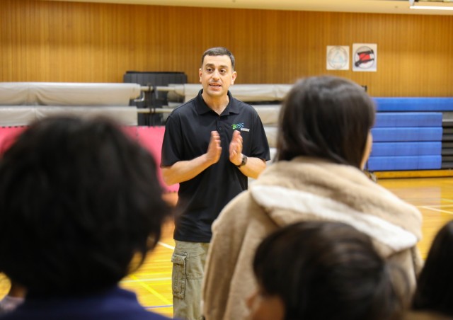 Command Sgt. Maj. David A. Rio, senior enlisted leader of U.S. Army Garrison Japan, welcomes children from the Sagamihara Minami Children’s Home before community members play dodgeball with them during an outreach event at Camp Zama, Japan, April 3, 2024. 