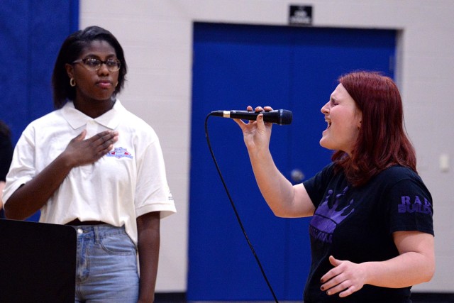 Fort Leavenworth, Kansas, Youth of the Year Rayna Klutse, senior at Leavenworth High School, places her hand over her heart as Alayna Parvin, freshman in music education at Baker University and lead singer for the Lansing, Kan.-based youth band...