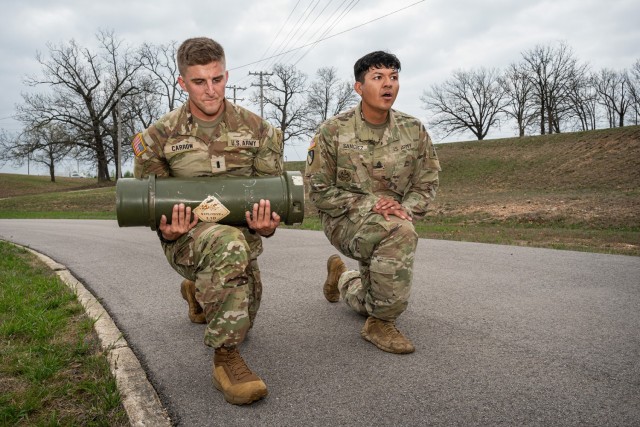 1st Lt. Aron Carrow and Sgt. 1st Class Guillermo Sanchez, with the 35th Engineer Battalion, train for the non-standard physical fitness test portion of the Best Sapper Competition April 1 at Training Area 106. According to the Best Sapper Competition’s Facebook page, the test consists of crater can front squats, burpees over a low wall, dead lifts, log step ups, low crawling through a tub on your back, crater can press ups, crater can squat thrusters, crater can lunges, a 200-meter crater can run and a 3-mile run. 