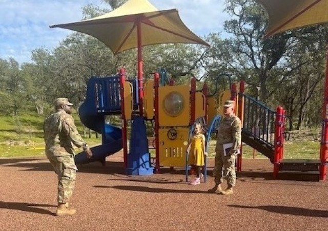 Julia Hudson at a Fort Hunter Liggett playground with post commander