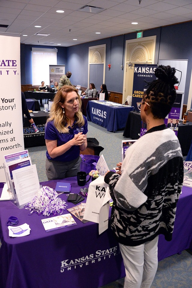 Kansas State University Fort Leavenworth Program Coordinator Bridget Rainey talks with 20-year-old Trayonna Cephas, who moved to Fort Leavenworth two weeks ago, as Cephas explores options at the Career and Education Fair April 2, 2024, at the...
