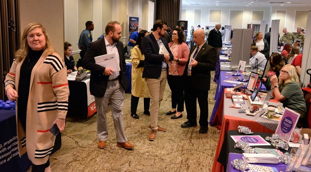 Fort Leavenworth Transition Services Manager Bob Jardon and Transition Services Specialist Lisa Fernholz, center right, browse the Career and Education Fair with Senate Committee on Veterans’ Affairs members Bradley Plukett, professional staff...