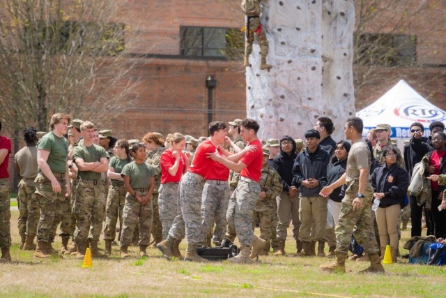 Bob Jones High School JROTC cadets share congratulations after winning a heat during the fitness challenge at JROTC Day.