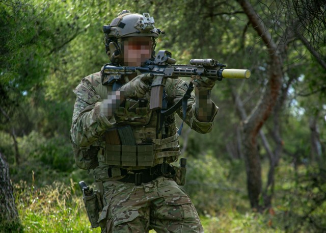 A Green Beret assigned to 10th Special Forces Group (Airborne) converges on a target during a simulated ambush for Exercise Trojan Footprint 24 near Nea Peramos, Greece, March 3, 2024. During Exercise Trojan Footprint, 10th SFG(A) is working in...