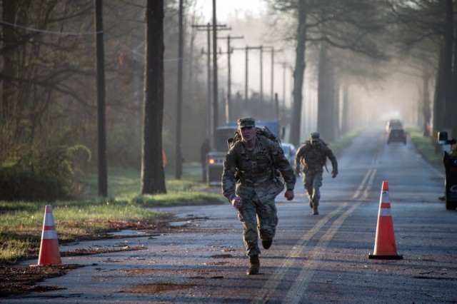 Staff Sgt. Christopher Miller, a combat engineer with U.S. Army Combat Capabilities Development Command, or DEVCOM, Command, Control, Communications, Computers, Cyber, Intelligence, Surveillance and Reconnaissance Center, crosses the finish line...