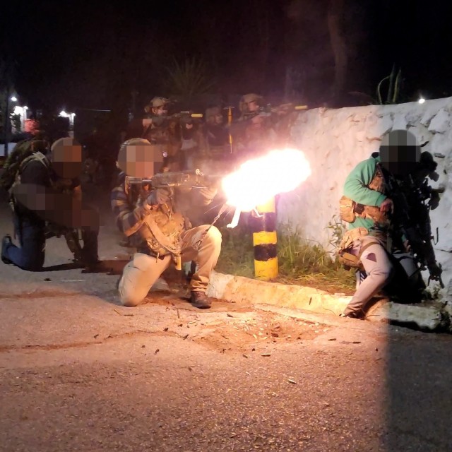 Green Berets assigned to 10th Special Forces Group (Airborne) and Greek special operations forces (SOF) soldiers react to enemy contact during a raid operation for Exercise Trojan Footprint 2024 near Nea Peramos, Greece, March 10, 2024. 10th...