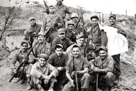 Members of the 65th Infantry Regiment pose for a photo after a firefight during the Korean War. The regiment consisted primarily of Puerto Rican soldiers who spoke mainly Spanish and prided themselves on having mustaches. By 1953, the regiment’s soldiers had earned 14 Silver Stars, 23 Bronze Stars for valor and 67 Purple Hearts.