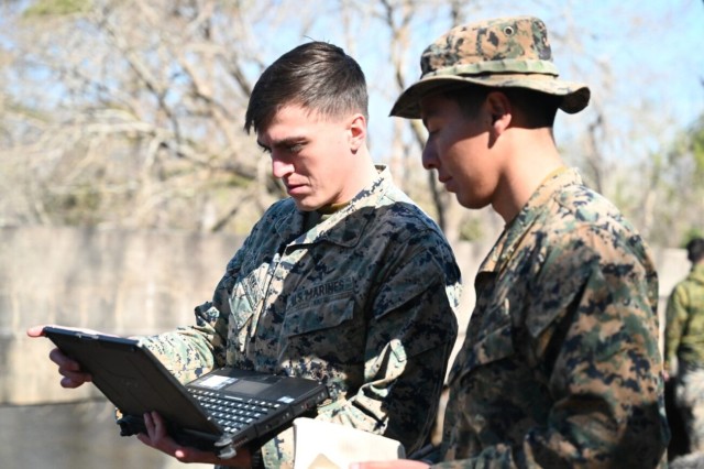 Marines with laptop computer.