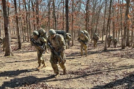 Trainees with Company A, 31st Engineer Battalion, ruck march in early March at Maneuver Area 24, during the pilot assessment of a new basic combat training culminating event concept called Forge 2.5, which includes large scale combat operations scenarios and continuous tactical operations, and is intended to be more realistic and challenging than its predecessor, all while also increasing the tactical skills of trainees and enabling cadre — including company command teams and drill sergeants — to develop as leaders. 