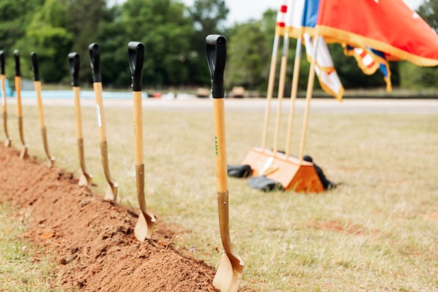 Gold shovels are planted into the soil during the groundbreaking ceremony for the Fort Novosel AIT barracks complex project on April 10, 2024. 