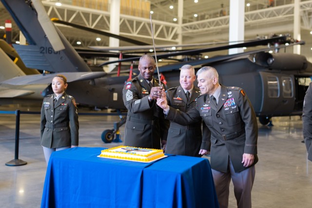 The USAACE command team cuts the 41st Army Aviation Branch birthday cake on April 12, inside the newly opened TSF on Fort Novosel.