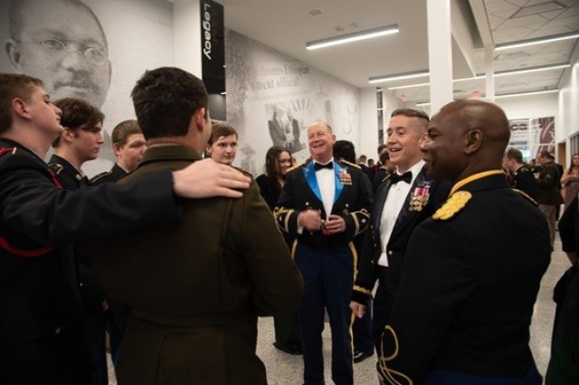 Cadets share a laugh with Lt. Gen. Robert Rasch Jr., second from right, commander of the Rapid Capabilities and Critical Technologies Office, at Saturday’s military ball at Alabama A&M University.