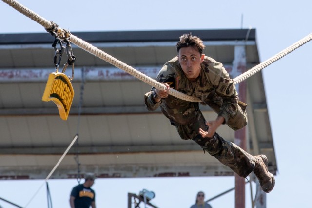 U.S. Army 1st Lt. Collin Johnson, assigned to the 75th Ranger Regiment, climbs across the rope to hit the Ranger tab on day 3 of the Best Ranger Competition, Fort Moore, Georgia, April 14, 2024. The David E. Grange Jr. Best Ranger Competition is a three-day competition that pits the military&#39;s best two-person Ranger teams against each other as they compete for the title of Best Ranger.

