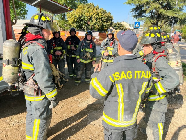 USAG Italy rookie firefighters take part in training for their Fire Fighter certifications on April 12 in the Villiaggio housing area. The scenario focused on rescuing victims in a simulated burning house and then rescuing a fellow firefighter through heavy smoke. 