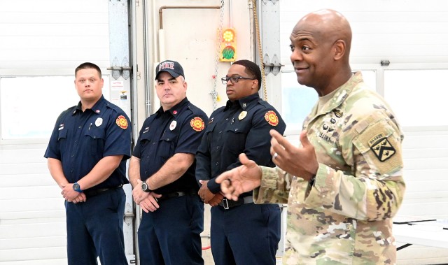 Combined Arms Center and Fort Leavenworth Commanding General Lt. Gen. Milford Beagle, right, recognizes 2023 Fort Leavenworth Fire and Emergency Services Firefighter of the Year Brandon Barufaldi, Fire Inspector of the Year Antonio Masisak and...