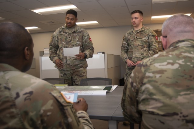 Spcs. Isaiah Graves and Jesse Wagner, with the 555th Engineer Brigade at Joint Base Lewis-McChord, Washington, provide a terrain analysis briefing to Army Engineer senior leaders April 13 in Brown Hall during the U.S. Army Engineer School’s...