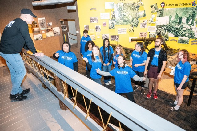 Teens look for the answer to one of their clues, a truck that can swim, during Fort Leonard Wood’s Night at the Museum overnight lock-in April 12 at Fort Leonard Wood’s John B. Mahaffey Museum Complex. The sleepover is part of the Month of the Military Child celebration.