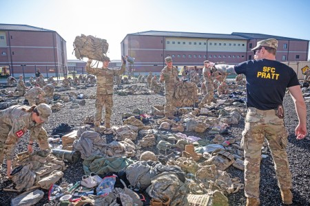 Sapper Leader Course cadre member, Sgt. 1st Class Ethan Pratt, checks Best Sapper competitors’ accoutrements during gear inspections April 17, 2024, in the physical training pit outside the Sapper Leader Course Headquarters building.
