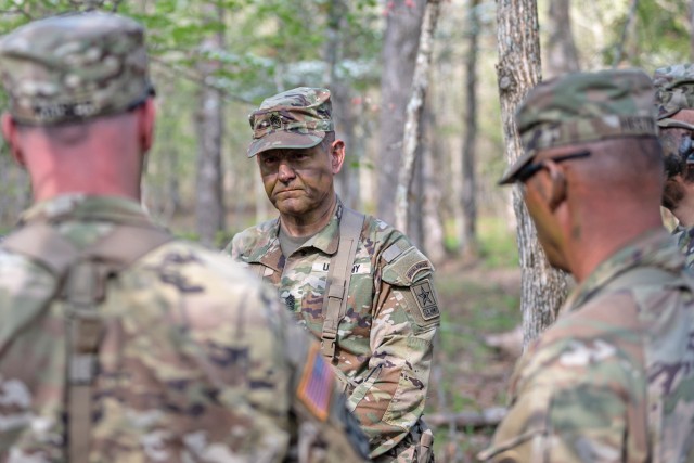 Sgt. Maj. of the Army Michael Weimer speaks with 1st Engineer Brigade Soldiers April 18 at Training Area 239 while observing cadre and trainees with Company D, 31st Engineer Battalion, participating in the Army’s new basic combat training...