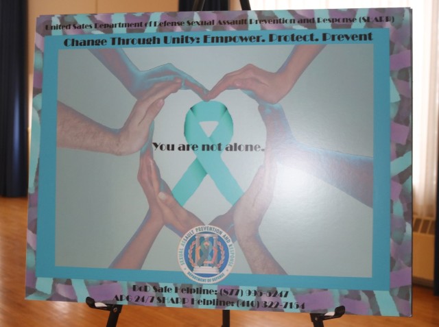 Sexual Assault Awareness and Prevention Month poster with hands making a heart around the phrase &#34;you are not alone.&#34;