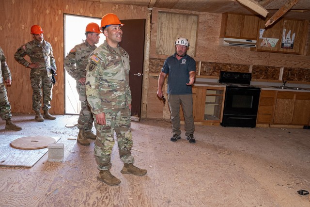 John Miller, Urban Search and Rescue Training Department supervisor (right), speaks with U.S. Army Training and Doctrine Command’s Command Sgt. Maj. Raymond Harris about some of the training capabilities at the Defense Civil Support Urban Search and Rescue training area April 17 during Harris’ visit to Fort Leonard Wood.