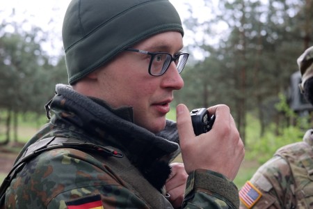 A German soldier speaks into a radio attached to a Radio Integration Communications Suite (RICS) during Saber Strike 24 on Bemowo Piskie Training Ground, Poland, April 18, 2024. The RICS is part of the Mission Partner Kit and enhances communication between the U.S., Allied, and partner nations participating in Saber Strike. DEFENDER is the Dynamic Employment of Forces to Europe for NATO Deterrence and Enhanced Readiness, and is a U.S. European Command scheduled, U.S. Army Europe and Africa conducted exercise that consists of Saber Strike, Immediate Response, and Swift Response. DEFENDER 24 is linked to NATO’s Steadfast Defender exercise, and DoD’s Large Scale Global Exercise, taking place from 28 March to 31 May. DEFENDER 24 is the largest U.S. Army exercise in Europe and includes more than 17,000 U.S. and 23,000 multinational service members from more than 20 Allied and partner nations, including Croatia, Czechia, Denmark, Estonia, Finland, France, Germany, Georgia, Hungary, Italy, Latvia, Lithuania, Moldova, Netherlands, North Macedonia, Norway, Poland, Romania, Slovakia, Spain, Sweden, and the United Kingdom.