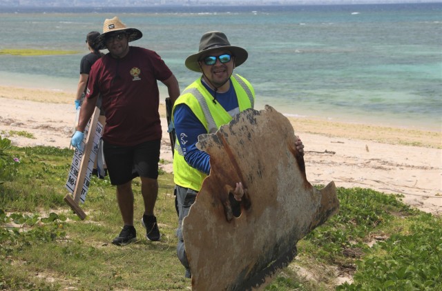 Volunteers on Okinawa work together to beautify beach on Earth Day  