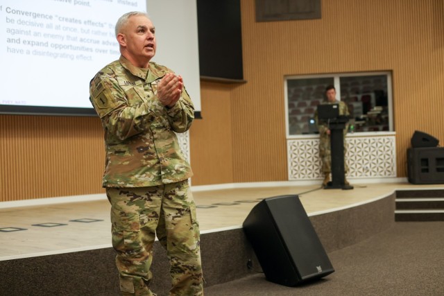 U.S. Army Brig. Gen. Kevin Lambert, the V Corps deputy commanding general, discusses how to create convergence on the second day of the a Warfighting Symposium at the Headquarters Multinational Corps South-East in Sibiu, Romania, April 18, 2024. The transformative concept of multi-domain operations empowers NATO to strategically influence events, synchronize efforts with external stakeholders, and present formidable challenges to adversaries. (U.S. Army photo by Spc. Joshua Maxie)