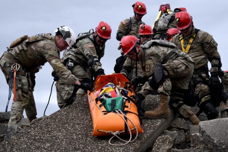 U.S. Army Soldiers from the New York National Guard’s 827th Engineer Company, 104th Military Police Battalion, lower a simulated casualty from rubble during a training exercise April 17, 2024. Led by personnel from the 42nd Infantry Division making up the Region II Homeland Response Force, the week-long exercise brought together elements from across the New York National Guard. 