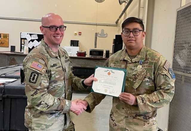 Capt. Cameron P. Clark (left) and Senior Airmen Steven T. Nguyen (right)